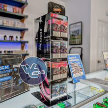 Load image into Gallery viewer, CrossBar Display stand with Crossbar disposable vapes with WC Vapor logo in a vape shop setting.