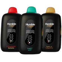 Load image into Gallery viewer, Three black Humble X-Treme Plus vape devices with different colored caps and flavor labels on a black background.